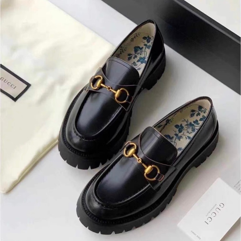 Gucci Women's Black Loafers with Gold Detailing